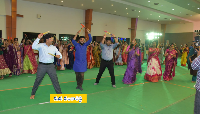 Sangareddy district police officers, staff, and officials celebrating Bathukamma festival at LN Convention Hall with cultural traditions.